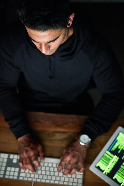 Hacker man and computer keyboard in night programming coding software or password hacking tablet and dark room Online code cyber security and programmer person hacking data on digital tech above