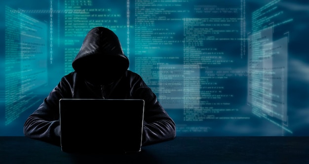 Hacking and technology crime concept No face hacker with laptop over programming code background