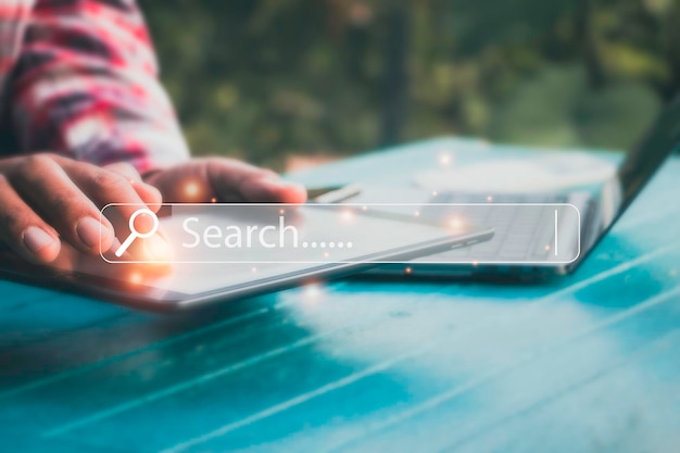hand man using laptop and searching browsing data on the internet online