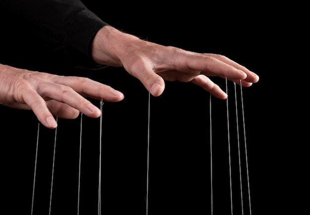 Hand manipulating and controlling smth with strings concept