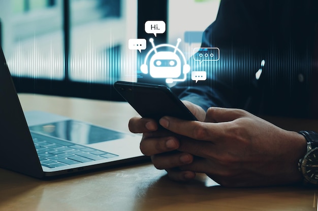 Hand of businessman using smartphone chatting with chat bot