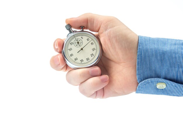 Hand with a mechanical analog stopwatch on a white background Time part precision Measurement of the speed interval