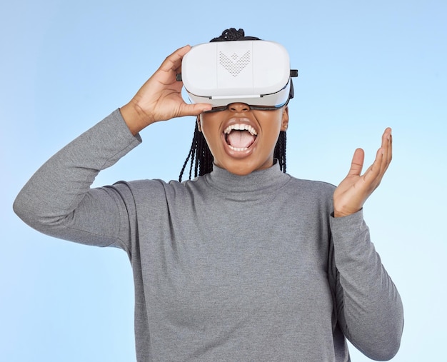 Happy gaming and vr with black woman and headset in metaverse for future cyber or 3d system Media ui and technology with gamer for internet augmented reality or digital in blue background studio