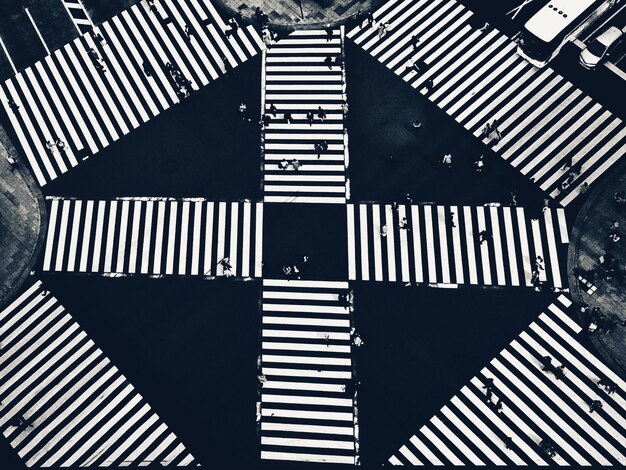 High angle view of people on zebra crossing in city