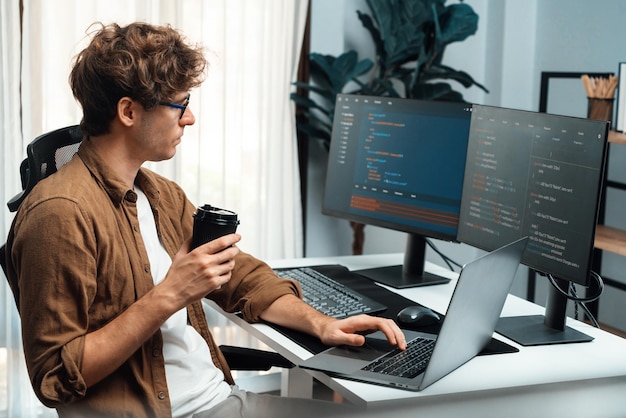 It developer holding coffee cup with looking online software on pc gusher