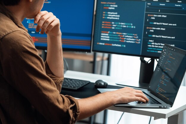 It developer working online software development coding on pc screens gusher