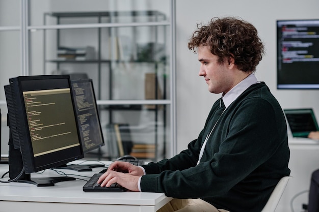 IT specialist writing codes for program