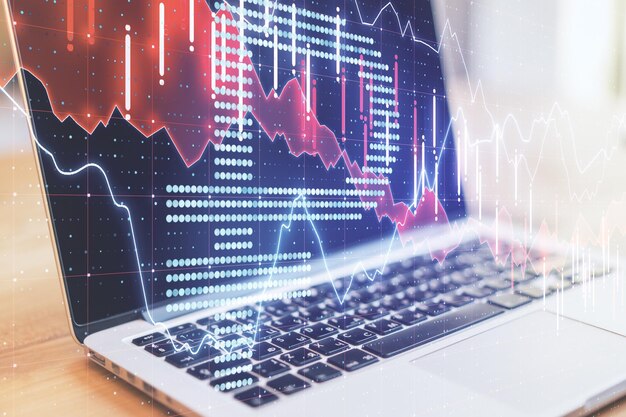 Laptop on desktop with ruble symbol and forex chart