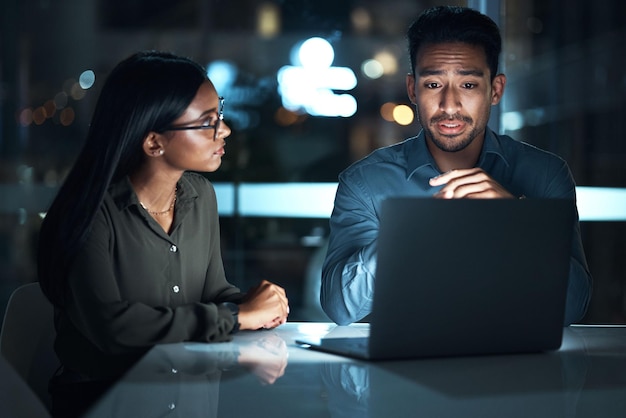 laptop planning and business people at night software development and programming solution in cybersecurity coding computer and teamwork programmer or it woman and manager for system update ideas