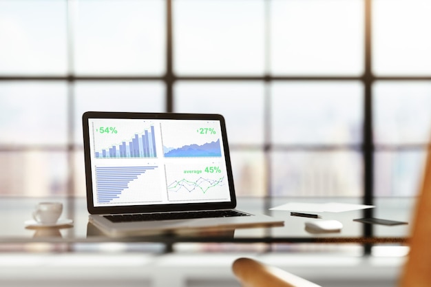 Laptop with financial statistics on a glass table with cup of coffee online trading concept 3D Rendering