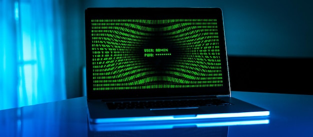 Laptop with green numbers on display successful login password technology protection concept