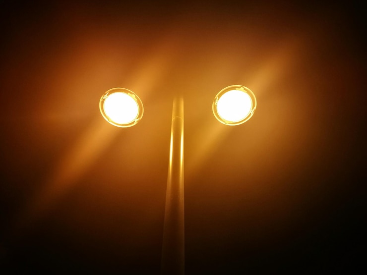 Kuva low angle view of illuminated street light at night