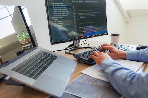 Low angle view of person using laptop on table