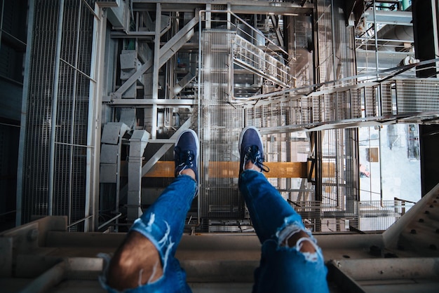 Low section of man standing at construction site