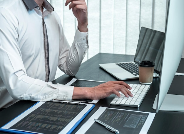 Low section of man working on table