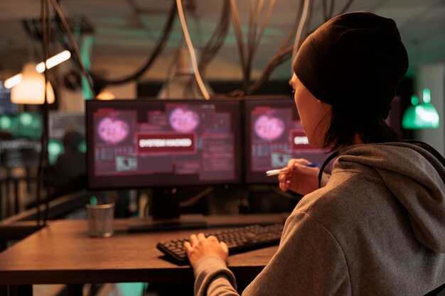 Male criminal reading system hacked alert on pc