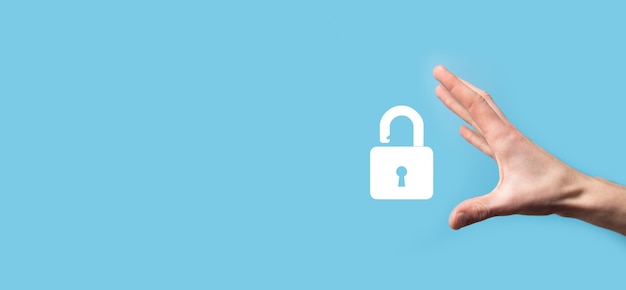Male holding a lock padlock icon. Cyber security network.