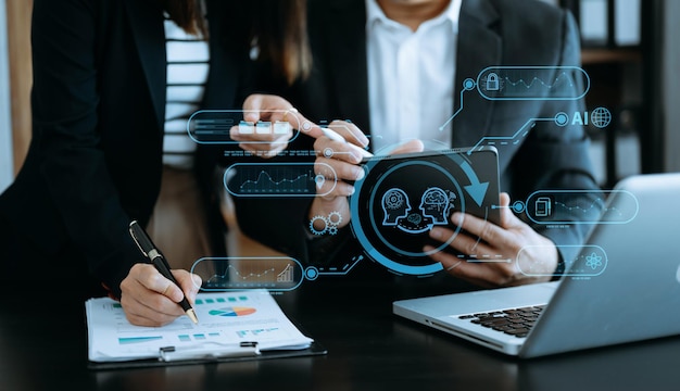 Man and woman using chatbot in computer and tablet smart intelligence Ai Chat with AI Artificial Intelligence developed by OpenAI generate Futuristic technology robot in online system in office