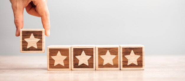 man hand holding star block customer choose rating for user reviews service rating ranking customer review satisfaction evaluation and feedback concept