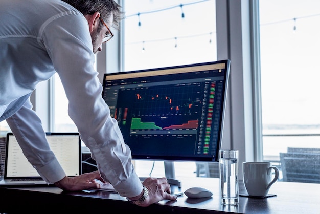Man looking at computer screen data