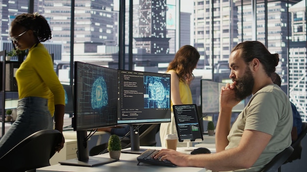 Man monitoring and maintaining artificial intelligence company systems