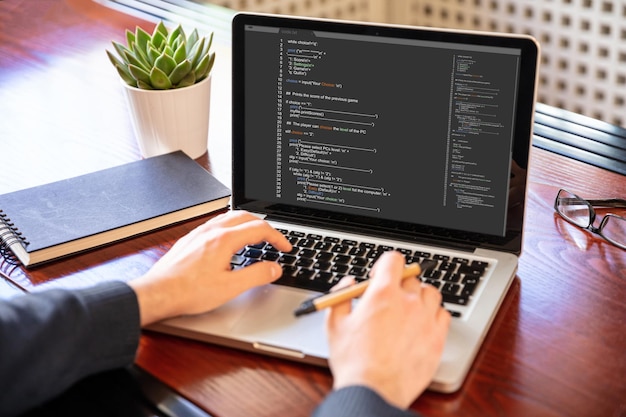 man programming on a computer office background