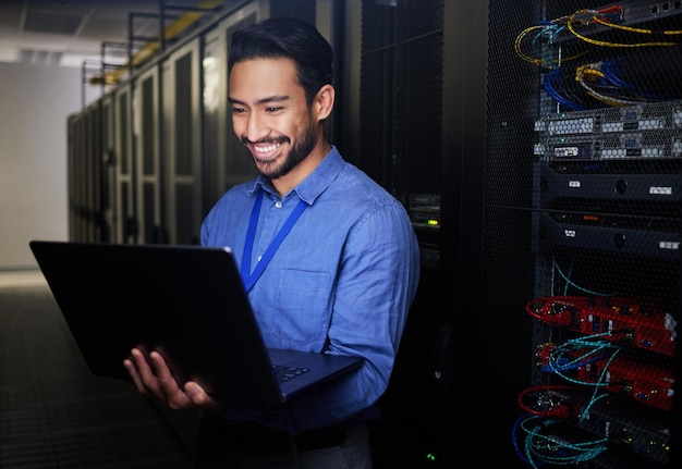 Man server room and computer for happy programming system solution and data center coding or cybersecurity Business person laptop and engineering network gdpr software and backup or maintenance