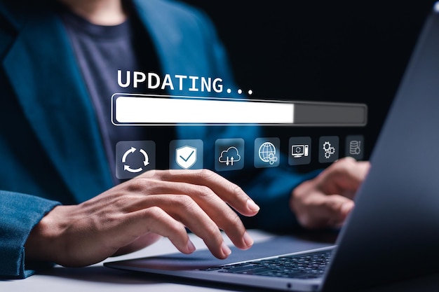 Man use laptop with virtual installing update bar Software updates or operating system upgrades to keep your device up to date with enhanced functionality in new versions and improved security