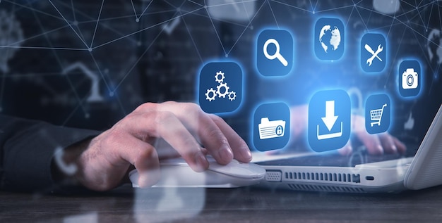 Man using computer App icons with a download symbol Development of applications Social networks and Software