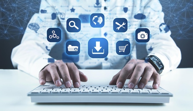 Man using computer App icons with a download symbol Development of applications Social networks and Software