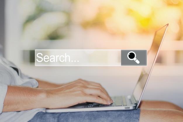 man using laptop with internet browser search bar