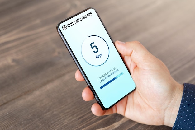 Man using mobile app to track and quit his smoking habit