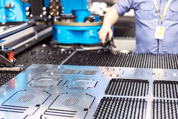 Man working at programmable cnc machine