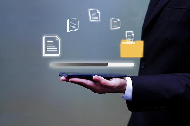 Man working on laptop with holding virtual data transmission icon Concept of future business