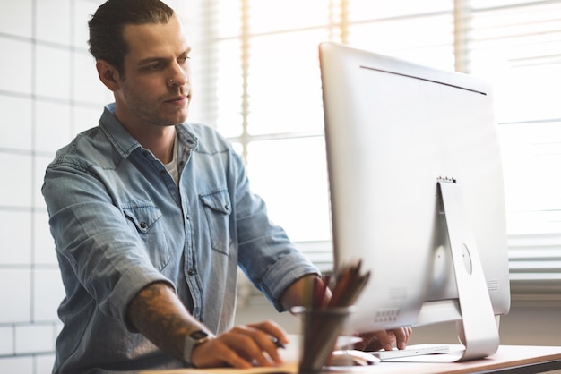 Man working on table in office