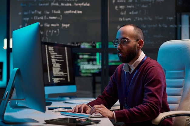 Man Writing Code in IT Department