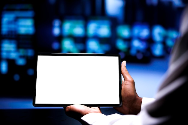 Manager using mock up tablet to repair servers helping businesses manage databases, host websites and store files. Supervisor overseeing supercomputers used for high performance computing, close up
