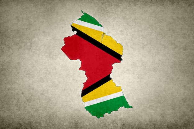 Map of Guyana with its flag on a paper
