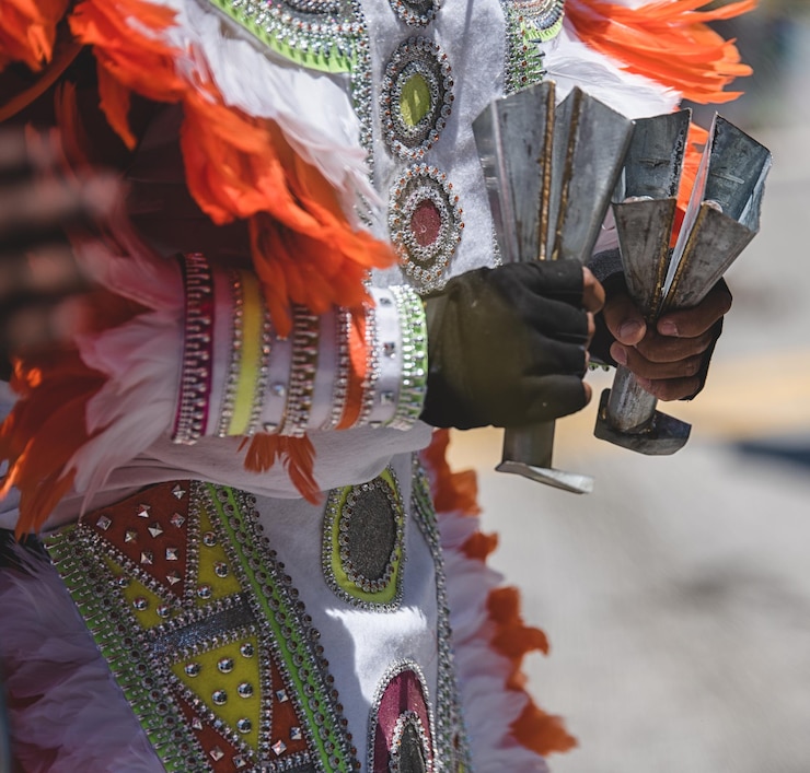 Kuva midsection of man in costume while holding musical instrument during carnival