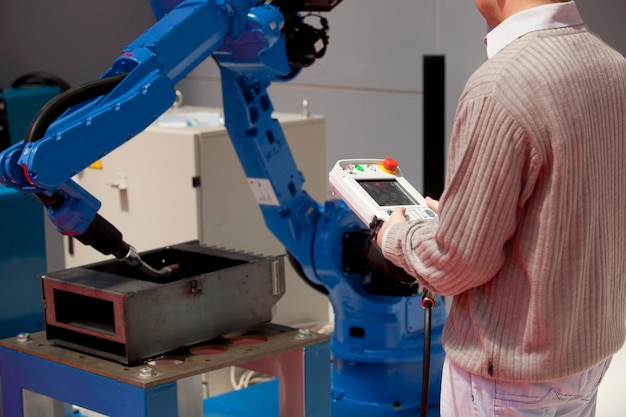 Midsection of man working in factory