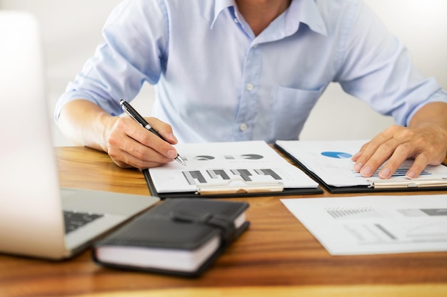 Midsection of man working in office