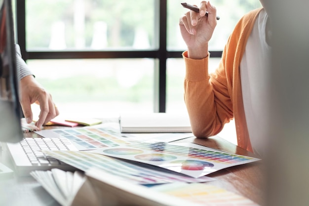 Midsection of woman holding umbrella with text on table
