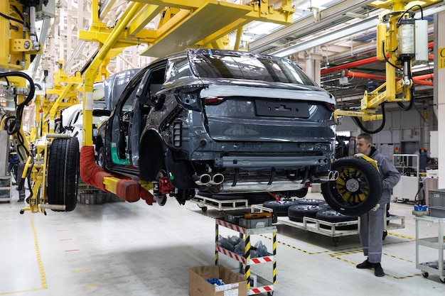 Minsk Belarus Dec 15 2021 Car bodies are on assembly line Factory for production of cars Modern automotive industry A car being checked before being painted in a hightech enterprise