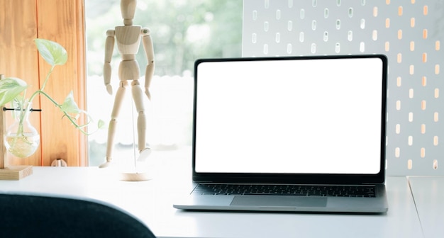 Mockup blank screen laptop on desk Workspace with laptop and office suppliesxA