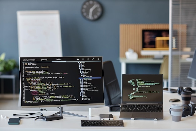 Modern Office Workspace Featuring Coding Screens