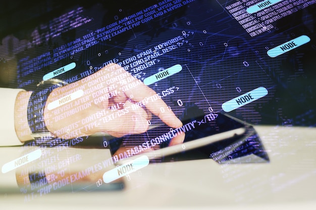 Multi exposure of abstract graphic coding sketch with world map and hand working with a digital tablet on background big data and networking concept
