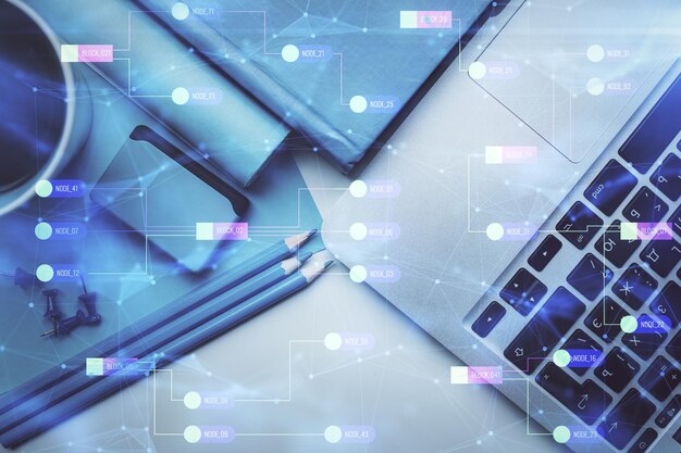 multi exposure of data drawing hologram over topview of study desk background with computer concept of technology
