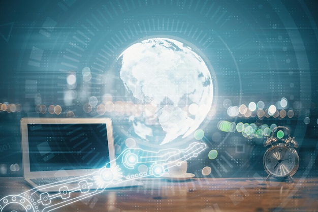 Multi exposure of table with computer and world map hologram International data network concept