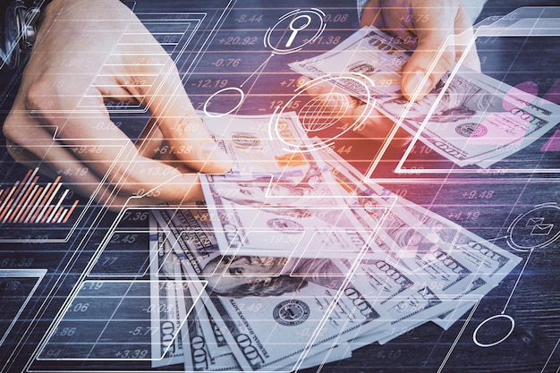 Multi exposure of technology drawing hologram and us dollars bills and man hands Data concept