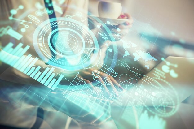 multi exposure of woman hands typing on computer and business theme hologram drawing success concept